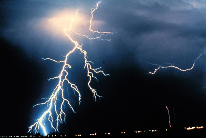 What initiates a lightning strike? In the image above, multiple cloud-to-ground and cloud-to-cloud lightning strikes are observed during a night-time thunderstorm. (Courtesy: NOAA)