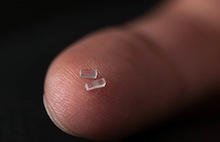 Nanofabricated chips of fused silica just 3 millimeters long were used to accelerate electrons at a rate 10 times higher than conventional particle accelerator technology. (Brad Plummer/SLAC)